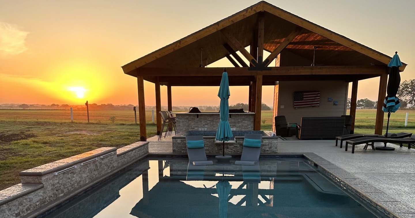 Pool and covered cabana at sunset